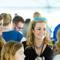 Guests standing in a group at the Jamie Hosford Football Center dedication.